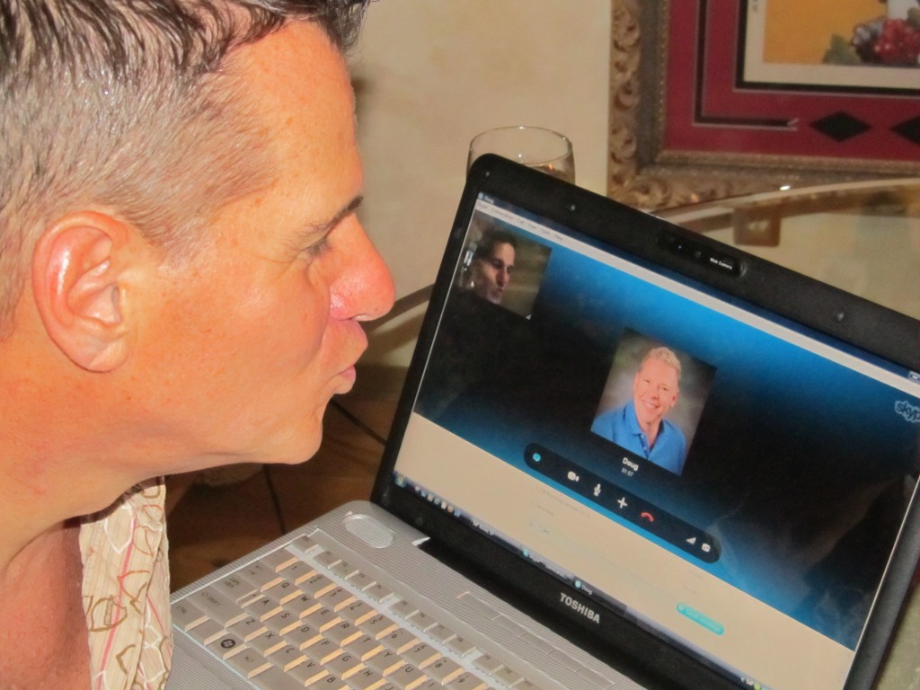 Pride Foundation Boise party host Carmine Caruso blows a virtual kiss to his partner Doug Flanders.