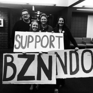 Coalition Members from left: Jamee Greer, MHRN; Kiah Abbey, Forward Montana; Kim Leighton, Pride Foundation; Niki Zupanic, ACLU of Montana – Standing with the Support Bozeman NDO signs after the NDO passed 2nd reading. 