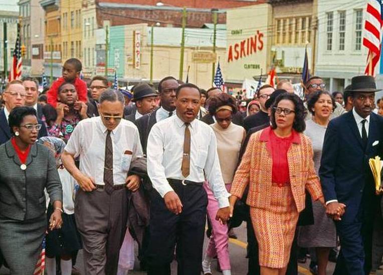 Dr. Martin Luther King Jr. and fellow activists at the Selma to Montgomery March in 1965 Photo Credit: Bob Adelman (Miami Herald)